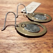 antique bronze satellite orbits a sterling silver moon handcrafted by allie b