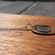 antique bronze satellite orbits a sterling silver moon handcrafted by allie b