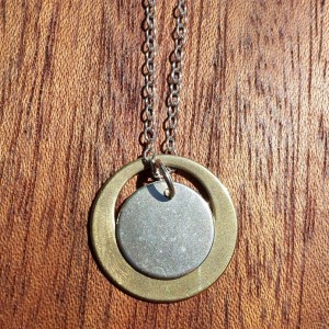 antique bronze satellite orbits a sterling silver moon handcrafted by allie b