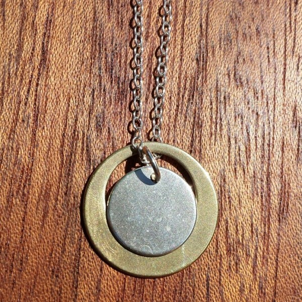 antique bronze satellite orbits a sterling silver moon handcrafted by allie b